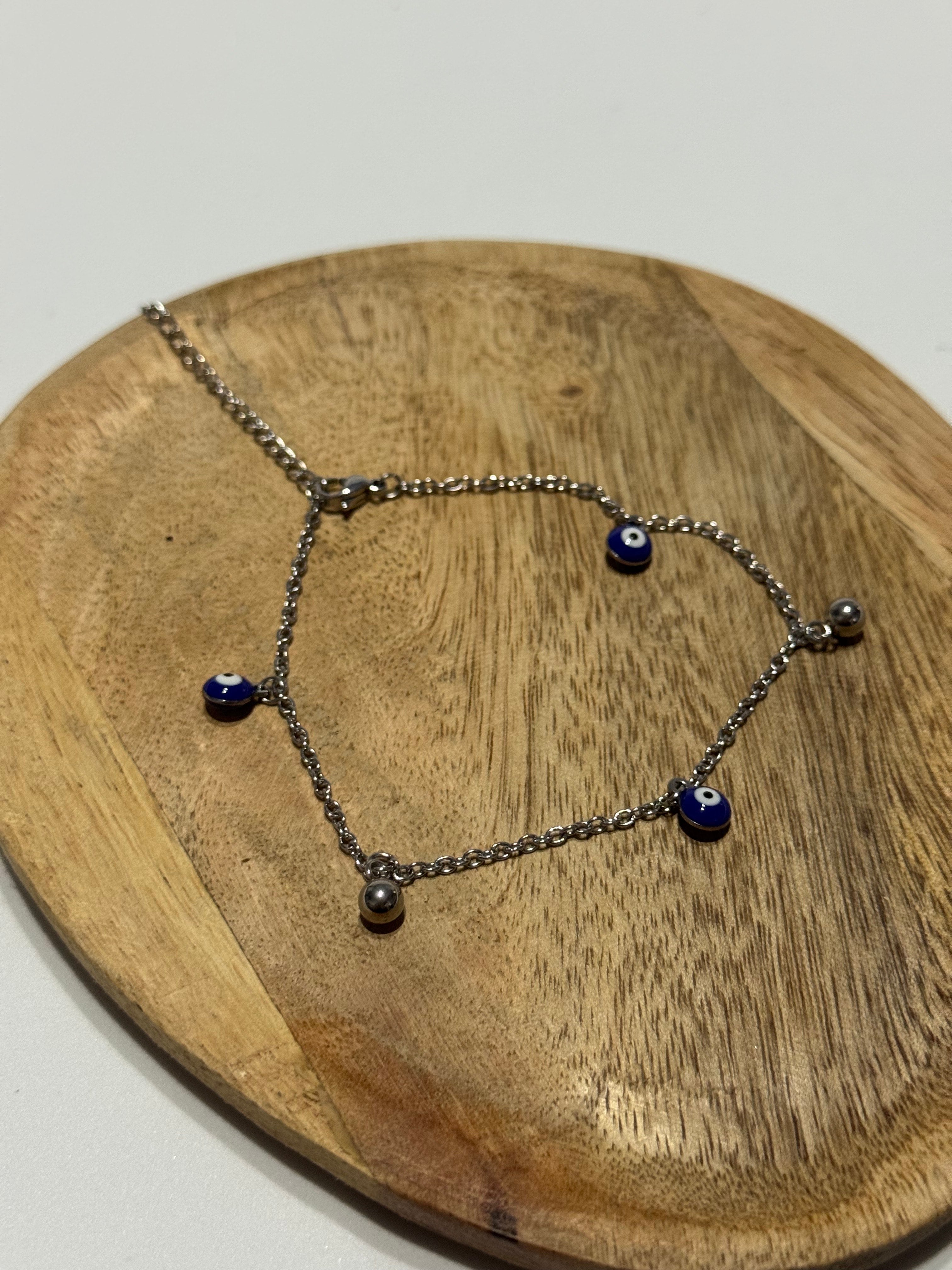 Pulseira de Pe olho CHECK 1